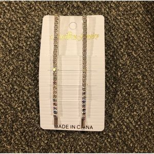 Brand new pair of silver rhinestone hairpins.